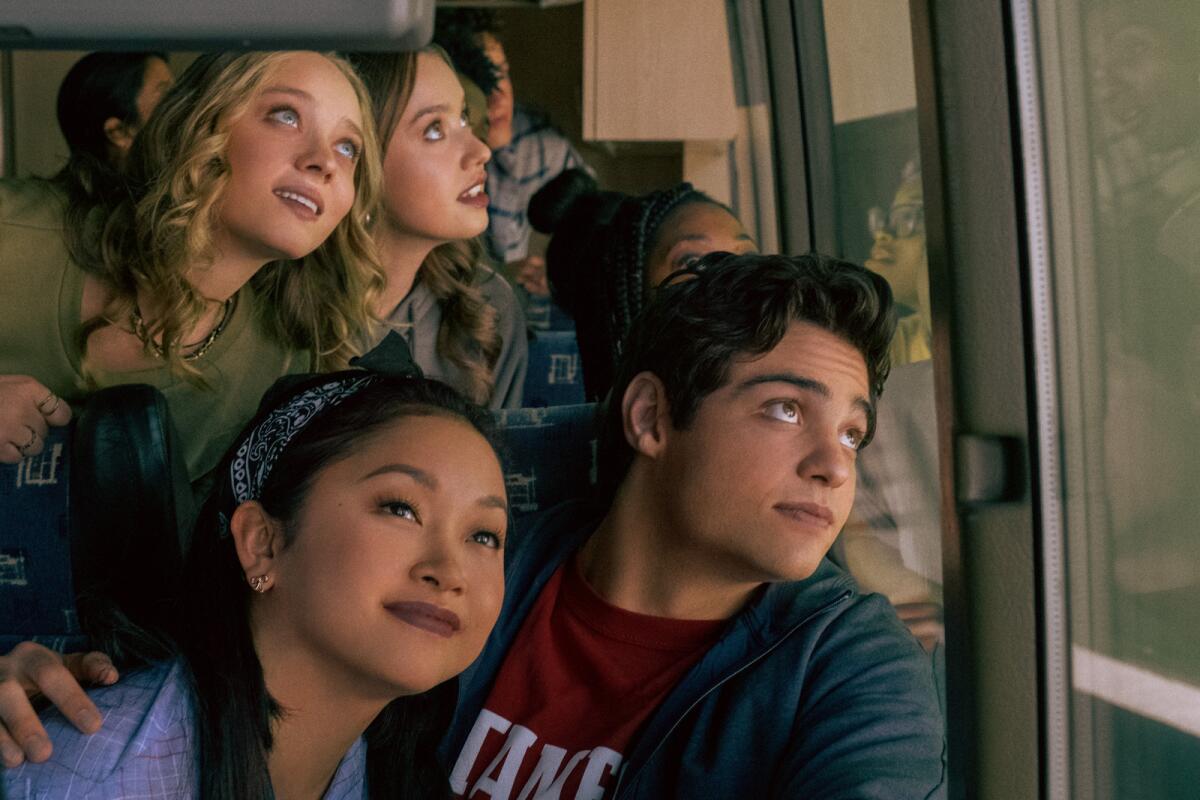 Lana Condor, left foreground, and Noah Centineo in the movie "To All the Boys: Always and Forever."