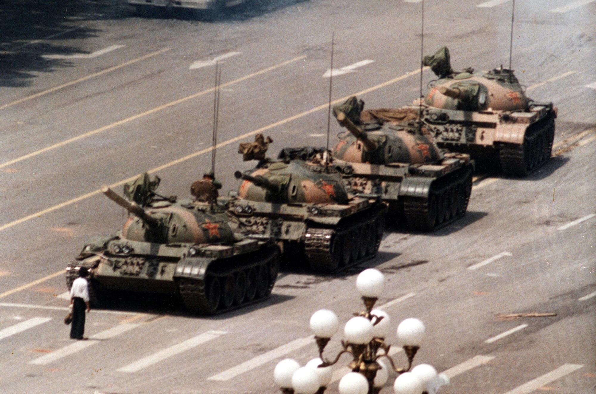 In this June 5, 1989, a Chinese protester blocks a line of tanks in front in Beijing.