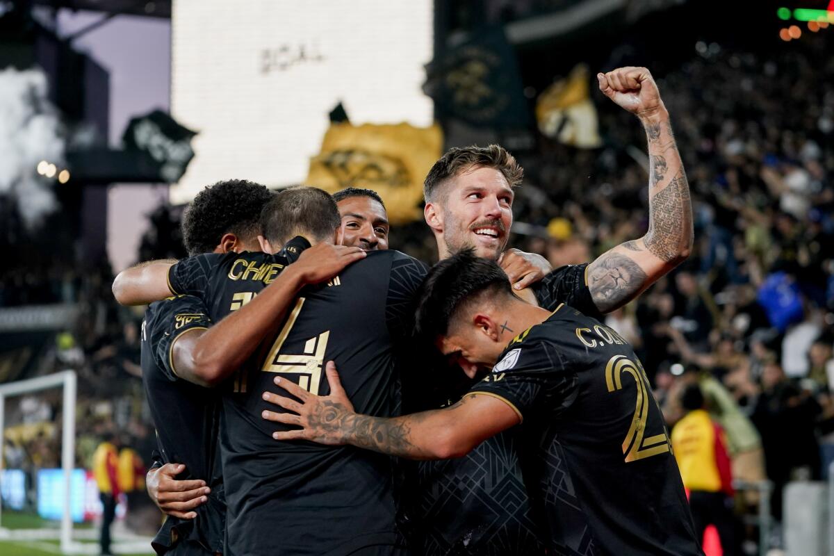LAFC midfielder Ryan Hollingshead celebrates with teammates after scoring in a playoff win over Vancouver.