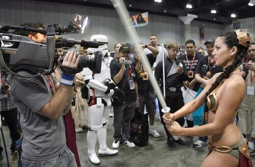 A fan in Leia's costume from "Return of the Jedi" performs for the media.