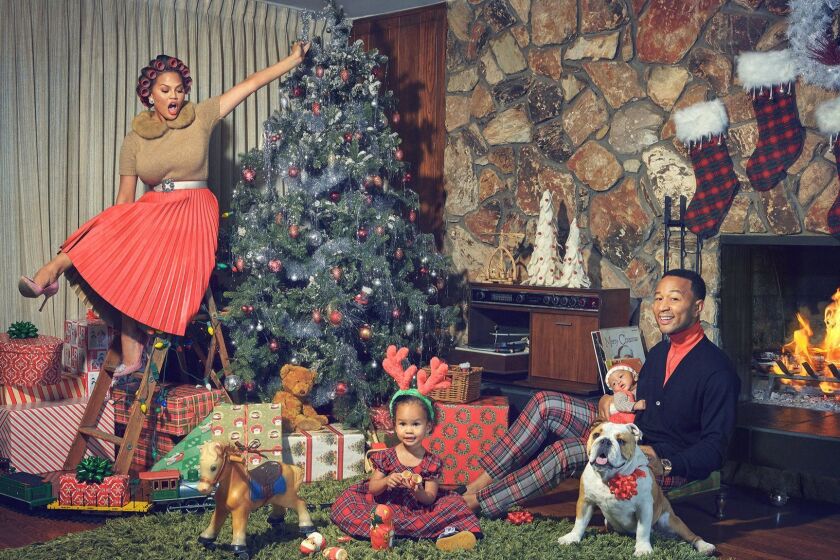 Newly anointed EGOT winner and critically acclaimed, multi-platinum singer-songwriter John Legend has announced his first Christmas album, A LEGENDARY CHRISTMAS. The album is executive produced by Raphael Saadiq and will be released by Columbia Records on October 26, 2018. Pictured: John Legend with Chrissy Tegan and daughter Luna Simone Stephens and son Miles Theodore Stephens.