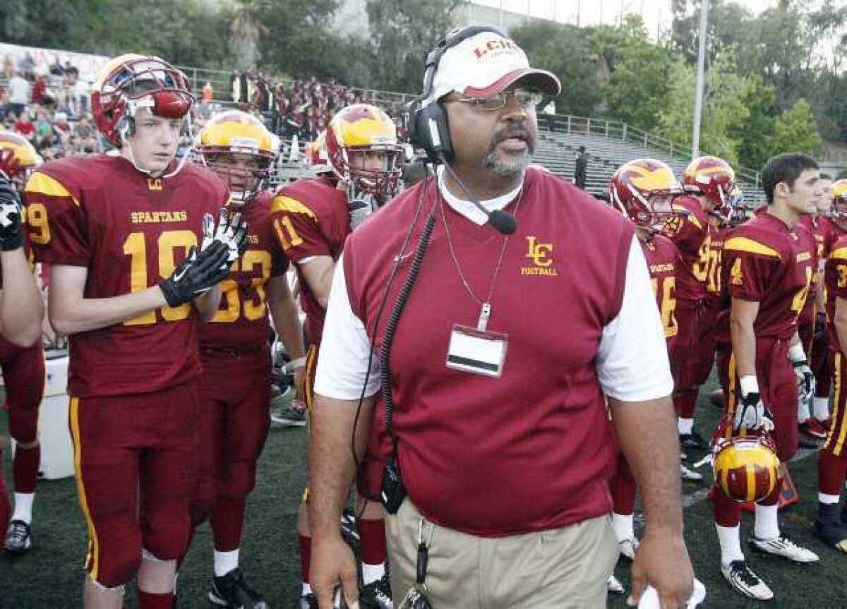 La Cañada High's head football coach James Sims on the sidelines in his debut against Alhambra.