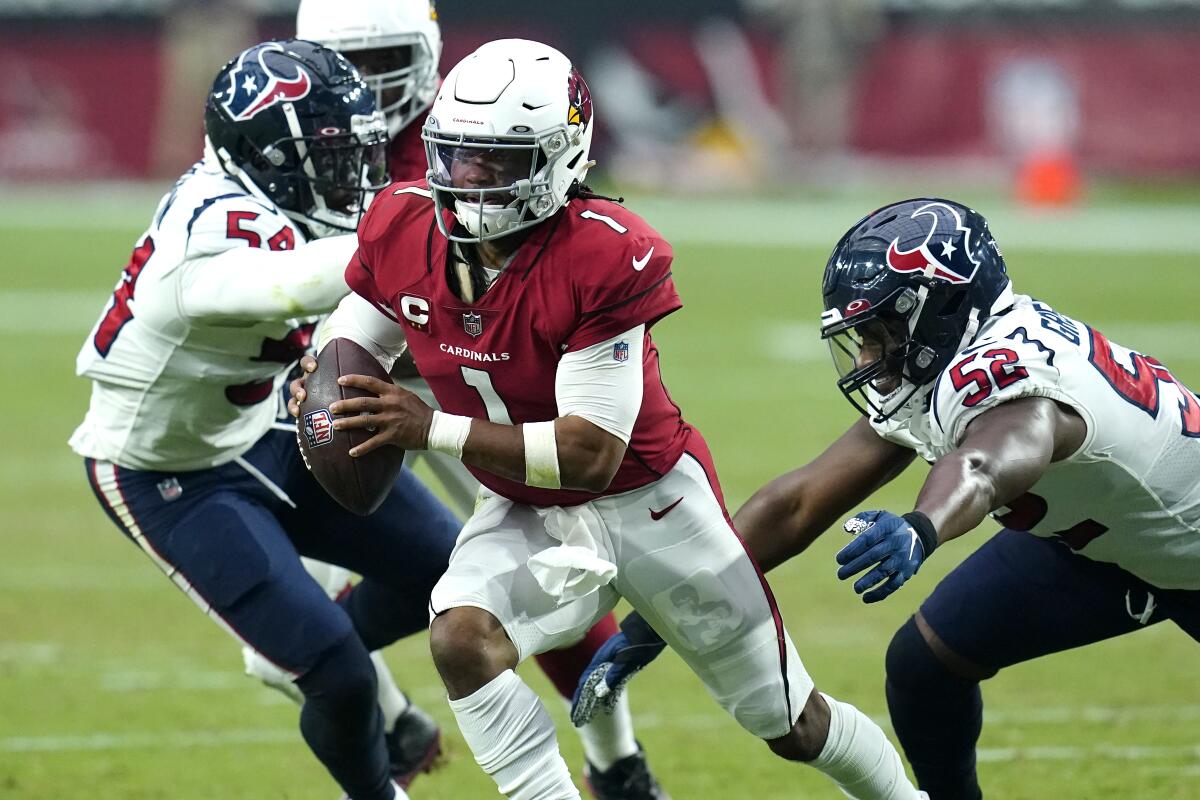 Arizona Cardinals quarterback Kyler Murray scrambles under pressure against the Houston Texans on Sunday.