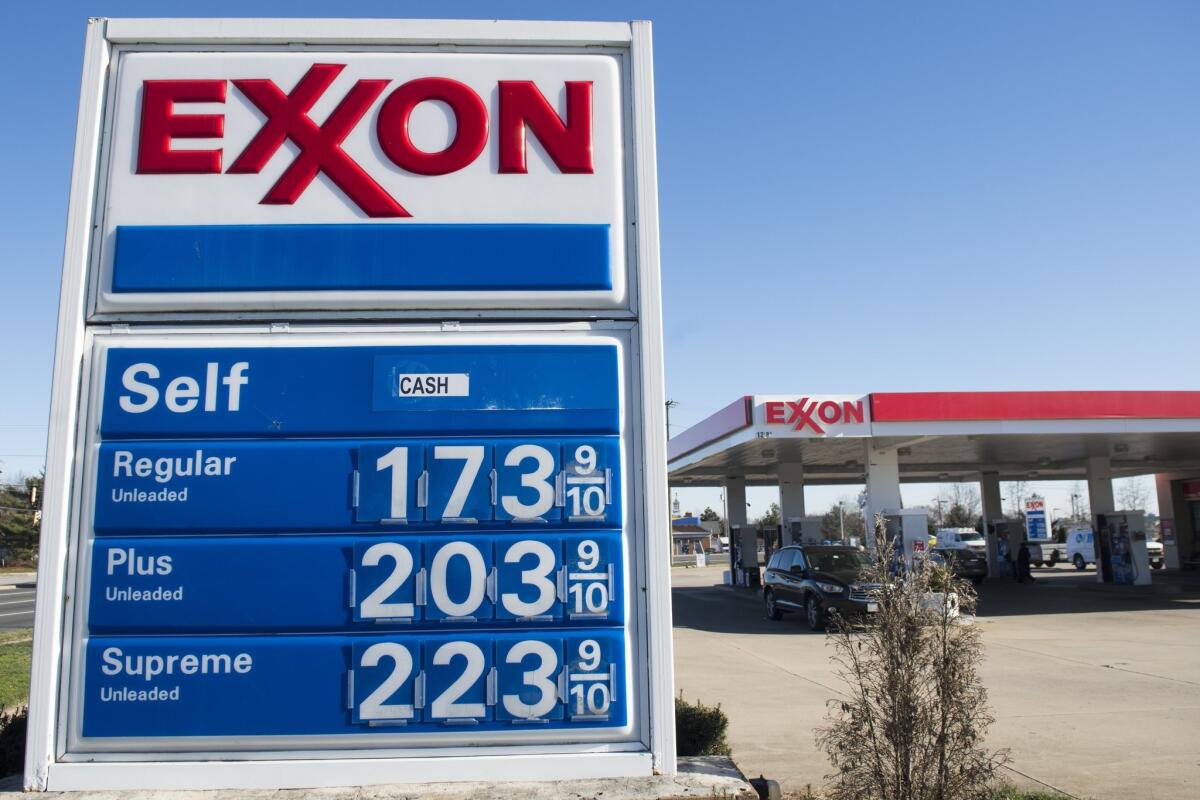 Gas prices are displayed at an Exxon gas station in Woodbridge, Va. on Jan. 5.