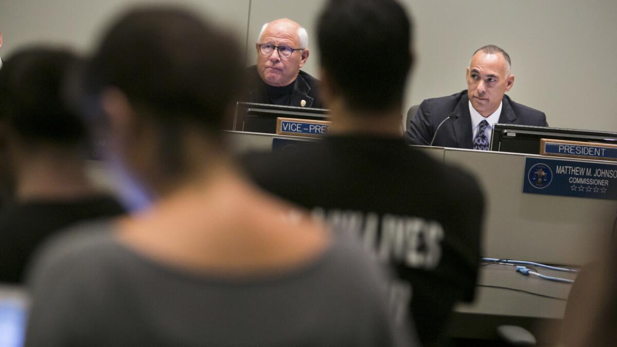 Members of the Los Angeles Police Commission, from left Steve Soboroff and Matthew Johnson, meet at LAPD headquarters earlier this year.