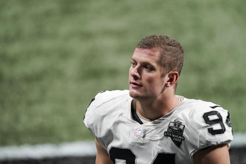 Las Vegas Raiders defensive end Carl Nassib (94) leaves the field after an NFL football game against the Atlanta Falcons, Sunday, Nov. 29, 2020, in Atlanta. The Atlanta Falcons won 43-6. (AP Photo/John Bazemore)