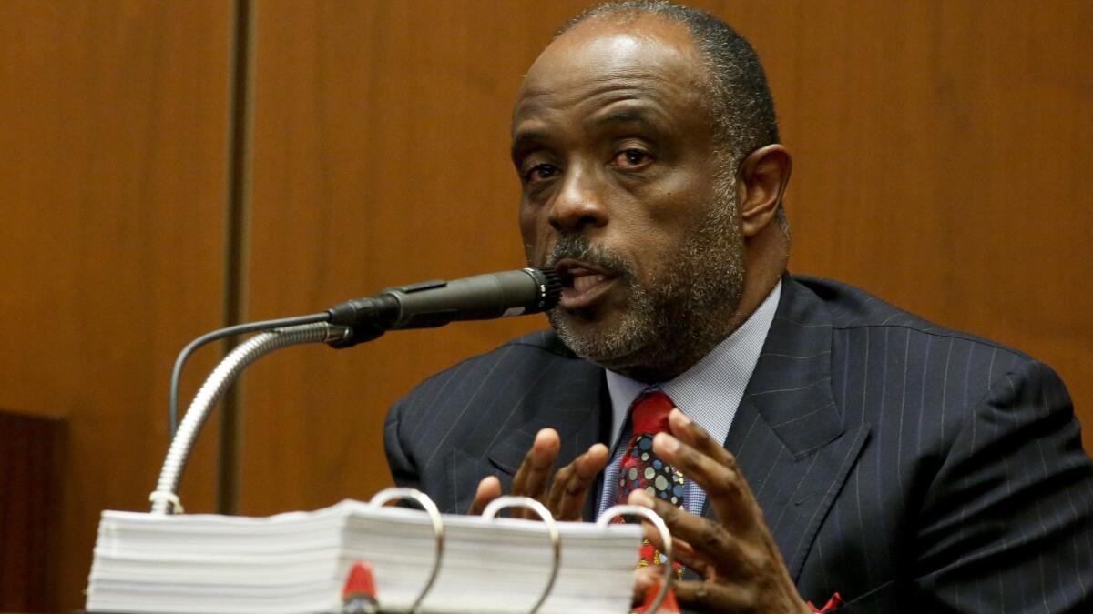 Former state senator Roderick Wright on the stand in his own defense during his trial in July 2014. Gov. Jerry Brown is considering his application for a pardon.