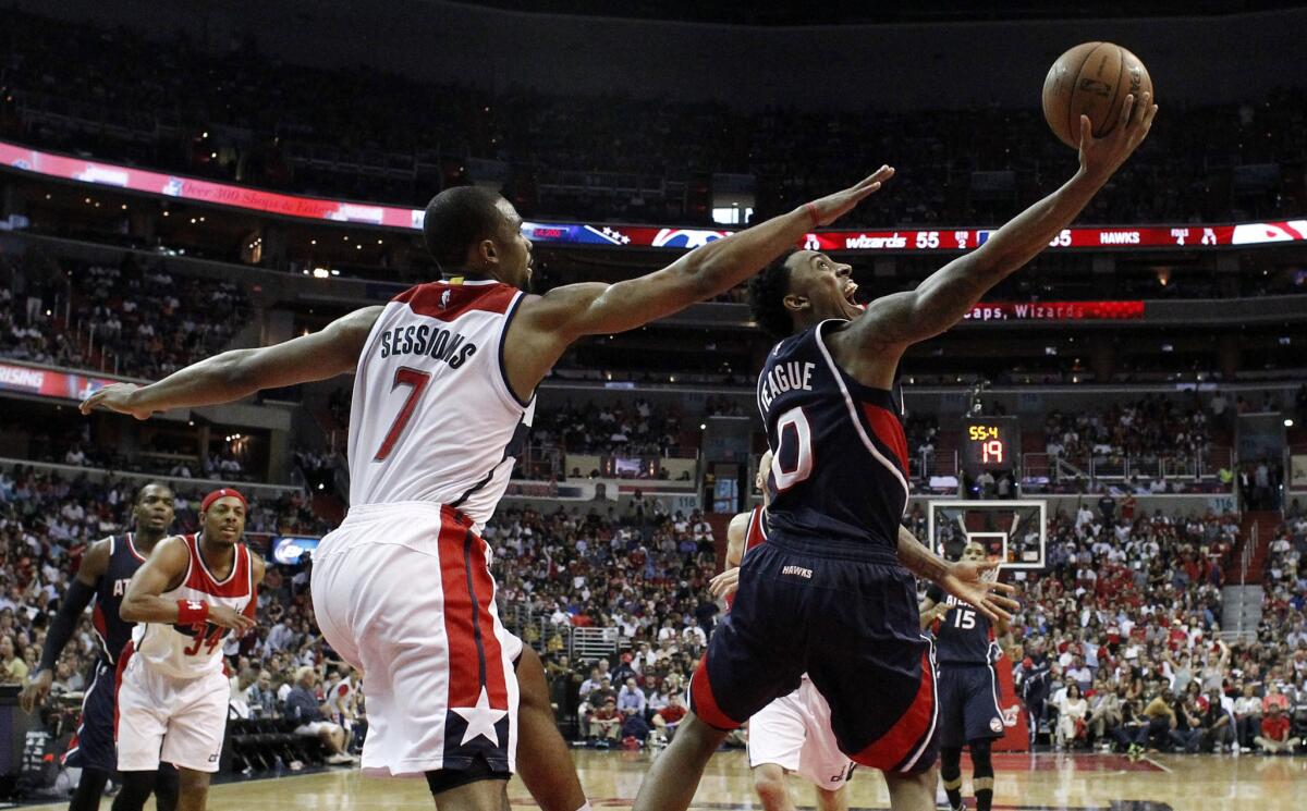 Hawks point guard Jeff Teague scored a game-high 26 points, including two on this reverse layup against Wizards point guard Ramon Sessions.