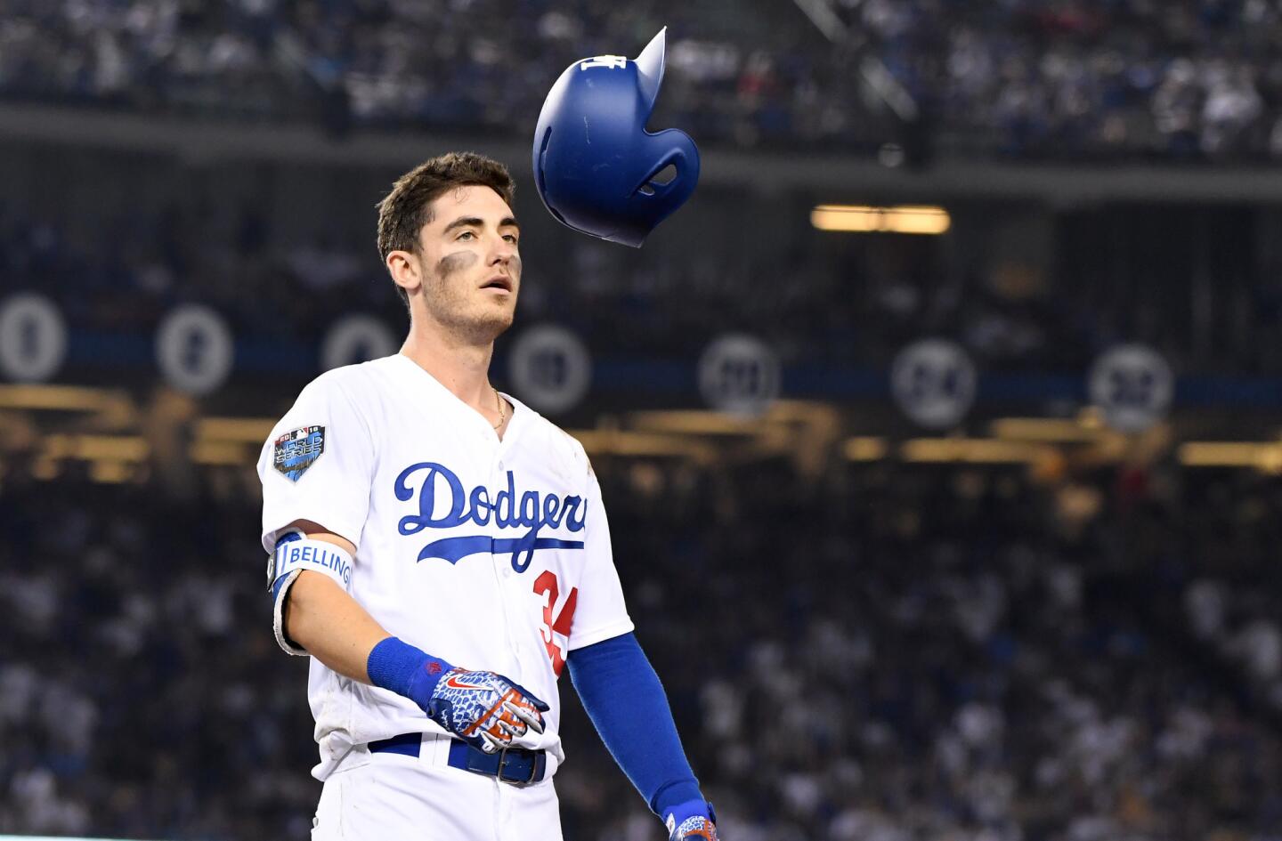 Dodgers Cody Bellinger flips his helmet after popping up against the Red Sox with a runner on base in the 6th inning.