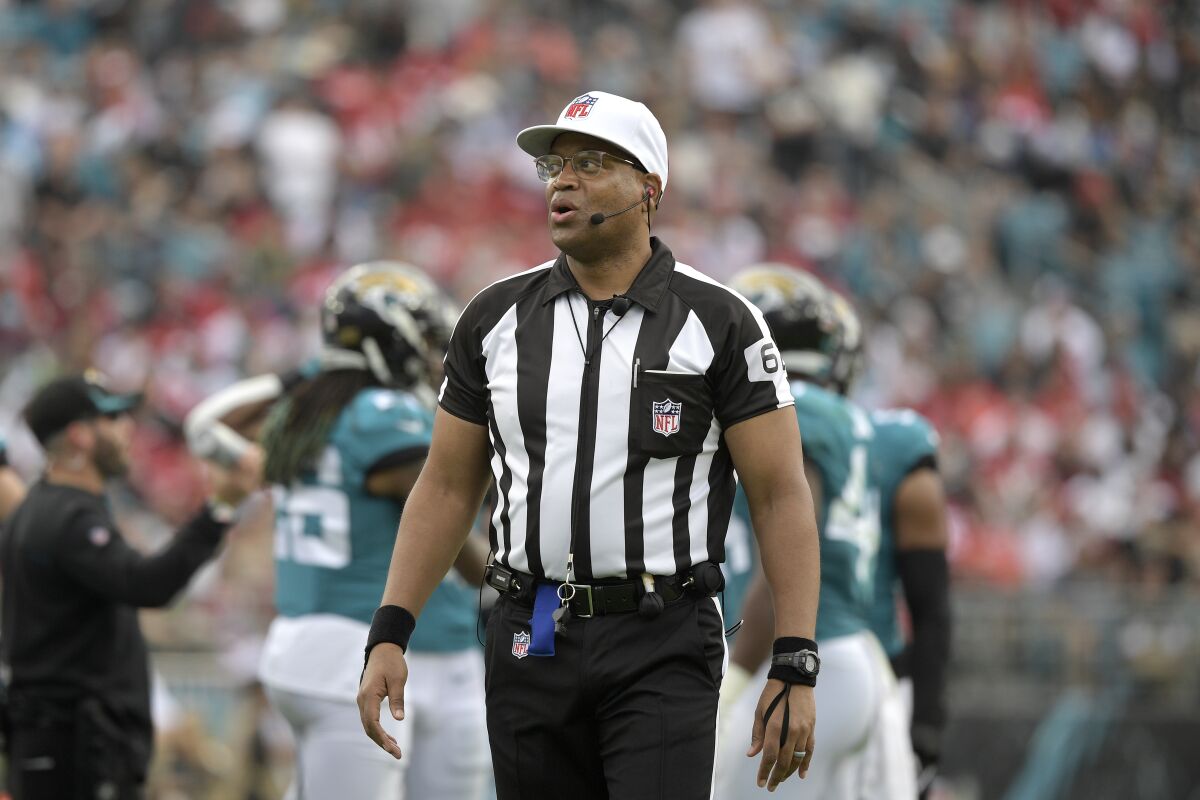 NFL referee Ronald Torbert stands on the field.