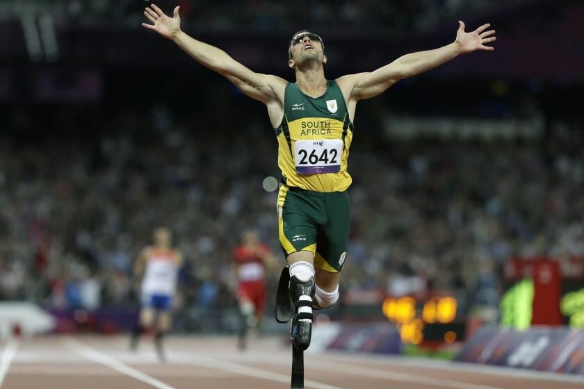 Oscar Pistorius, shown winning the men's 400-meter T44 final at the 2012 Paralympics in London, is awaiting trial for the alleged murder of girlfriend Reeza Steenkamp.