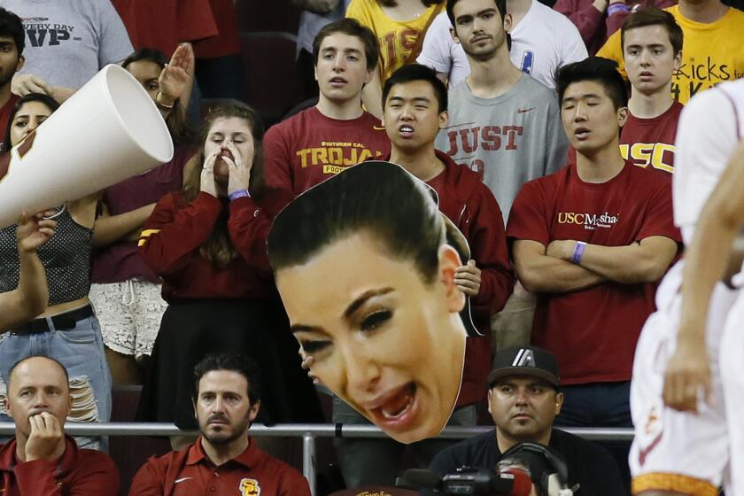 Kim Kardashian image is so ubiquitous that USC basketball fans have been using it to distract opponents during free throws. But she's publicized only one photo of her son.