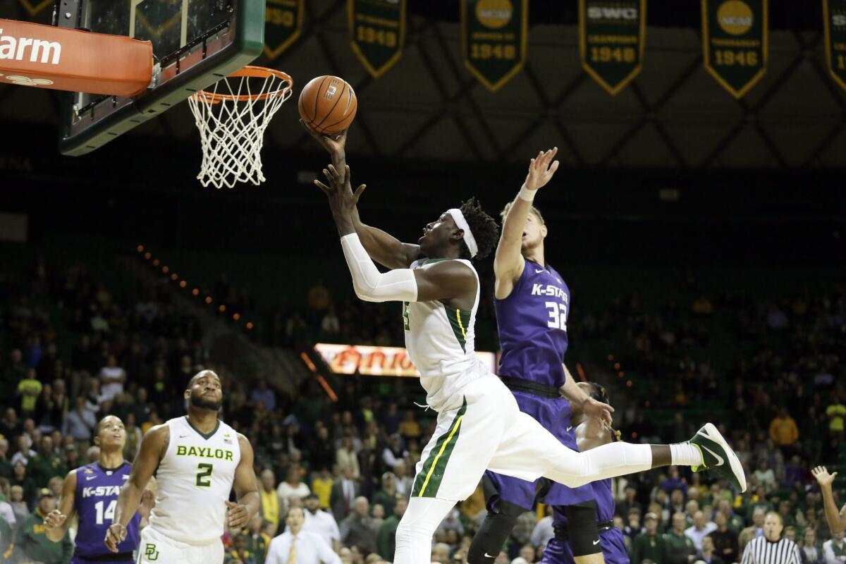 Baylor forward Johnathan Motley goes up for a shot after getting past Kansas State's Dean Wade during a game on Jan. 20. Baylor won in double overtime, 79-72.