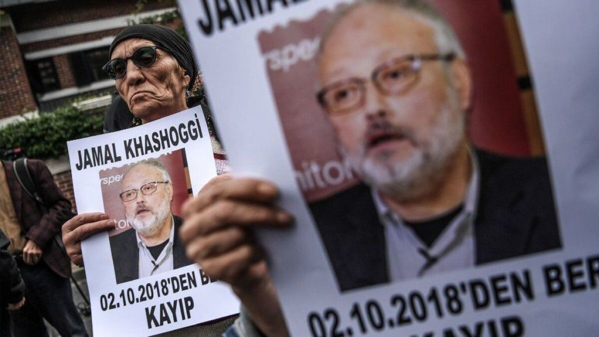 Protesters stand outside the Saudi consulate in Istanbul, where journalist Jamal Khashoggi is acknowledged to have died on Oct. 2.