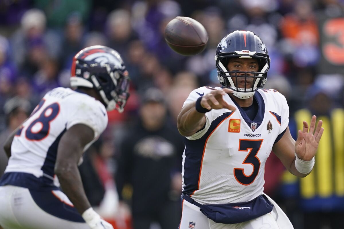 Denver Broncos quarterback Russell Wilson (3) passes in the first half of an NFL football game against the Baltimore Ravens, Sunday, Dec. 4, 2022, in Baltimore. (AP Photo/Patrick Semansky)