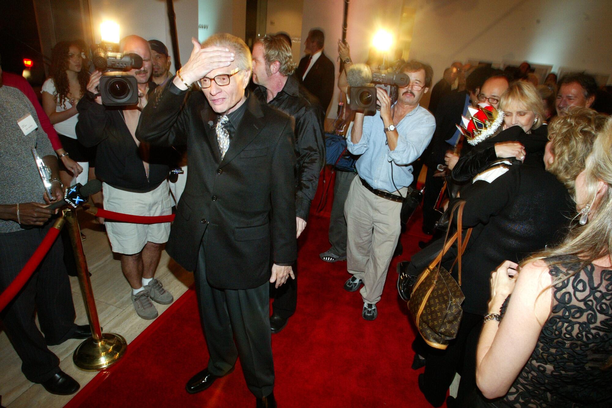 Larry King is surprised and overwhelmed arriving at the Museum of Television and Radio for his 70th birthday bash in 2003
