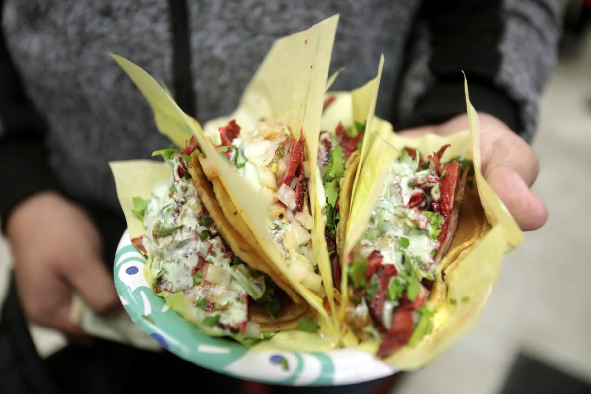 The Tijuana-style adobada (spicy pork) tacos with cilantro and avocado sauce at Tacos El G in the San Diego neighborhood of National City on Jan. 20.