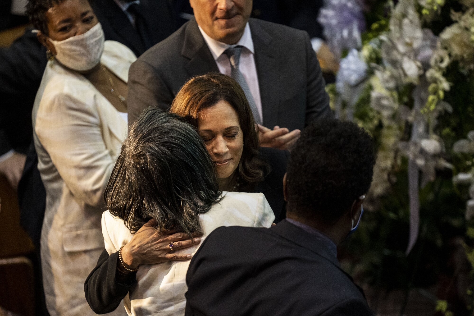 Kamala Harris hugs the woman.