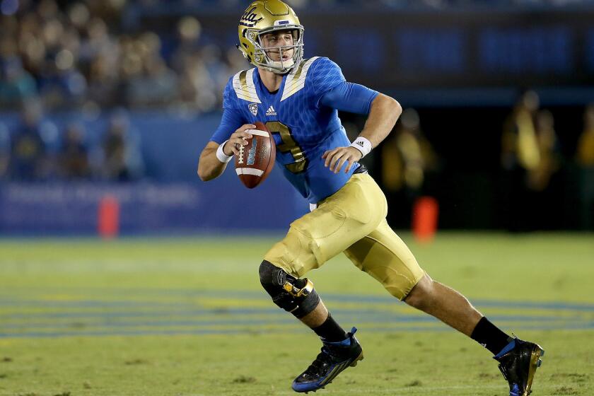 UCLA quarterback Josh Rosen scrambles out of the pocket against BYU in the second quarter.