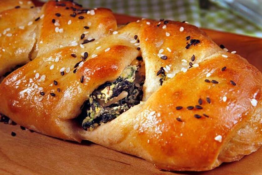Dairy dishes, such as a spinach and ricotta-stuffed challah, are traditionally served during Shavuot.