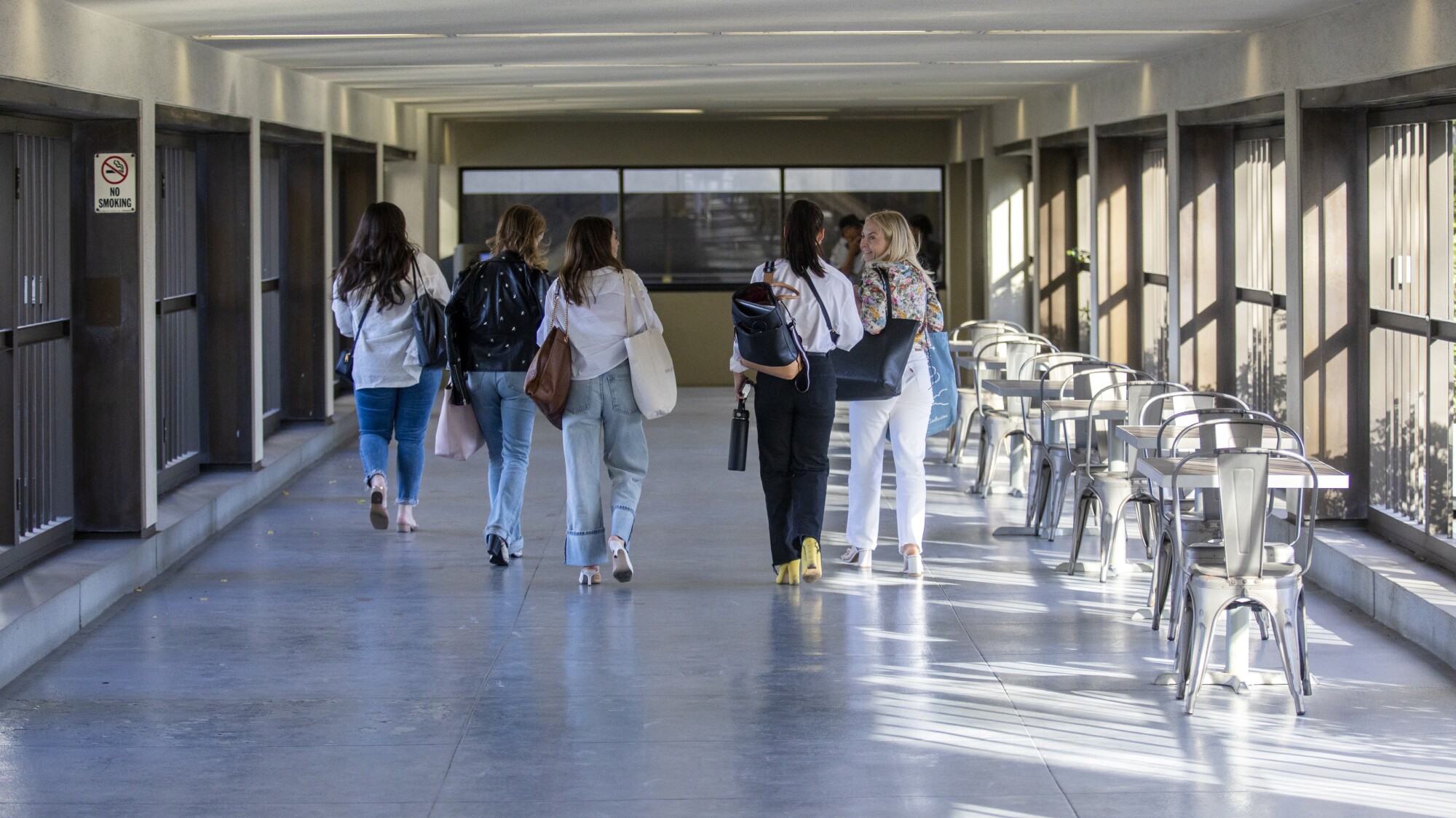 Women head toward the parking lot at California Market Center in Los Angeles.