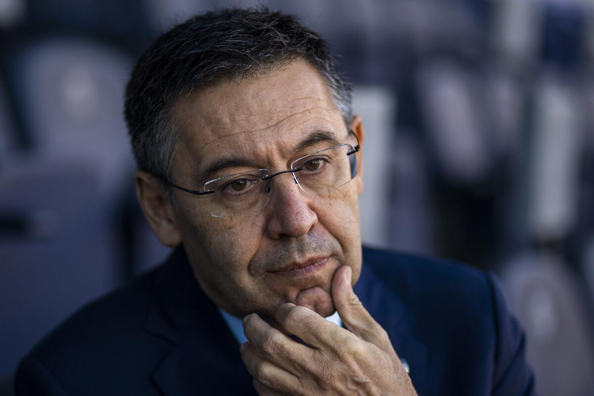 FILE - In this Nov. 8, 2019, file photo, President of FC Barcelona Josep Bartomeu pauses during and interview with the Associated Press at the Camp Nou stadium in Barcelona, Spain. Spanish police entered Barcelona's stadium on Monday March 1, 2021 and detained some people in a search and seize operation related to an investigation into club officials. The operation was related to last year's "Barçagate," in which club officials were accused of launching a smear campaign against current and former players who were critical of the club and then-president Josep Maria Bartomeu. (AP Photo/Emilio Morenatti, File)