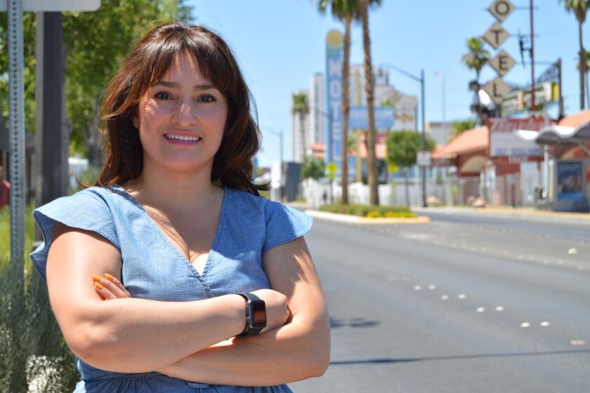 Mayra Salinas-Menjivar, 31, on Fremont Street in Las Vegas, Nevada. Salinas-Menjivar became a naturalized citizen in 2018 through an immediate family petition. She said she is not surprised that Latinas like herself are more likely to vote than U.S.-born citizens. "You donÕt know what you have until you donÕt have it,Ó she said.