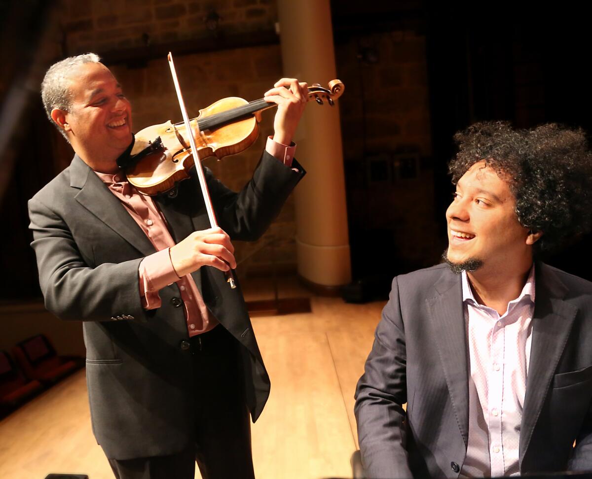 (L-R) Ilmar Gavilan and Aldo Lopez-Gavilan play at Jarvis Hall, Napa. From the documentary "Los Hermanos/The Brothers."