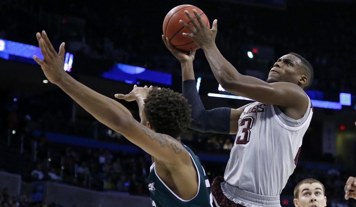Texas A&M guard Danuel House shoots over Green Bay forward Jamar Hurdle in the first half of the first round of the 2016 men's NCAA Tournament on Friday in Oklahoma City.