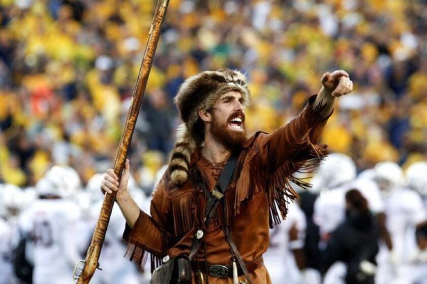 Mountaineer mascot Jonathan Kimble fires up fans during a game earlier this season.