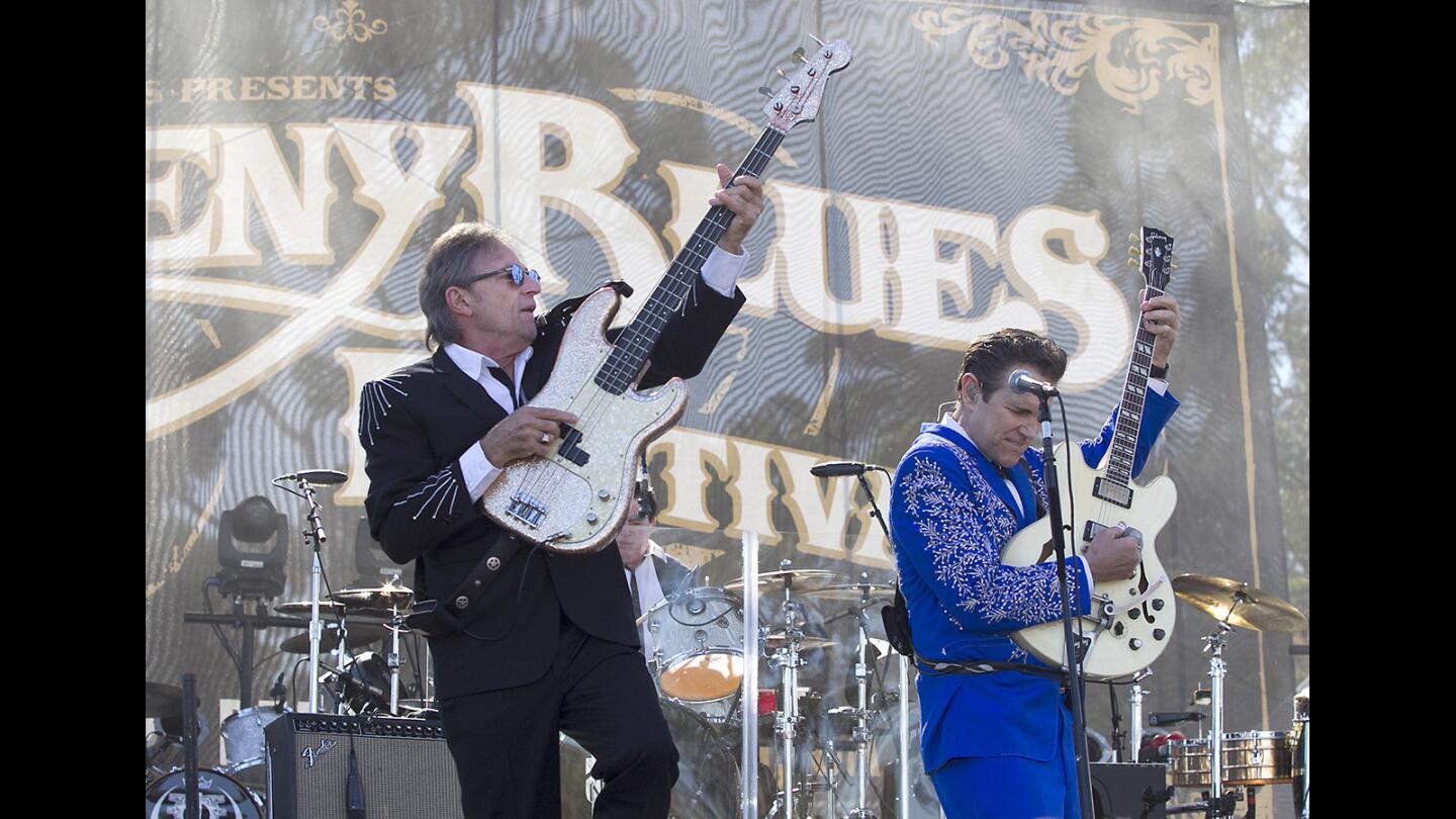 Chris Isaak, right, and longtime bassist Rowland Salley perform "Pretty Woman" on the Doheny Stage during the 20th Doheny Blues Festival on Sunday.