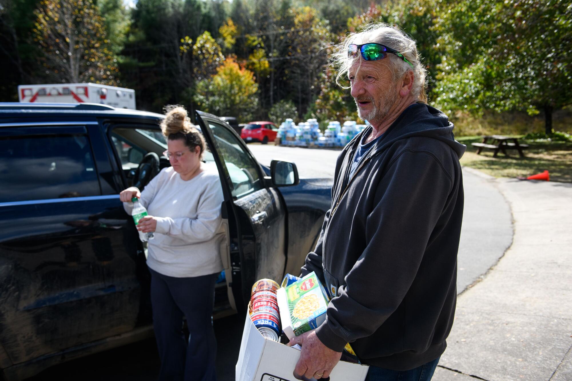 Jeff Vance, right, donates supplies at Riverside Elementary School. 