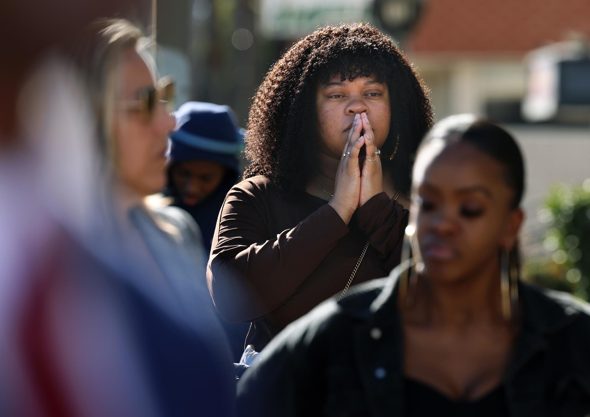 Selina Littlefield (centre) attends a news conference demanding answers about the death of 9-year-old Princeton Jones.