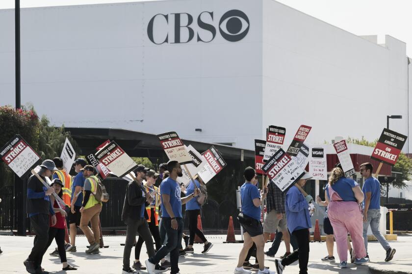 Hollywood, CA - September 24: Members of WGA picket in front of CBS Television City on Sunday, Sept. 24, 2023 in Hollywood, CA. Saturday marked the fourth straight day of talks, which kicked off Wednesday with the heads of four major studios participating directly. The union and studio alliance had not announced a deal as of early Saturday evening. (Allen J. Schaben / Los Angeles Times)