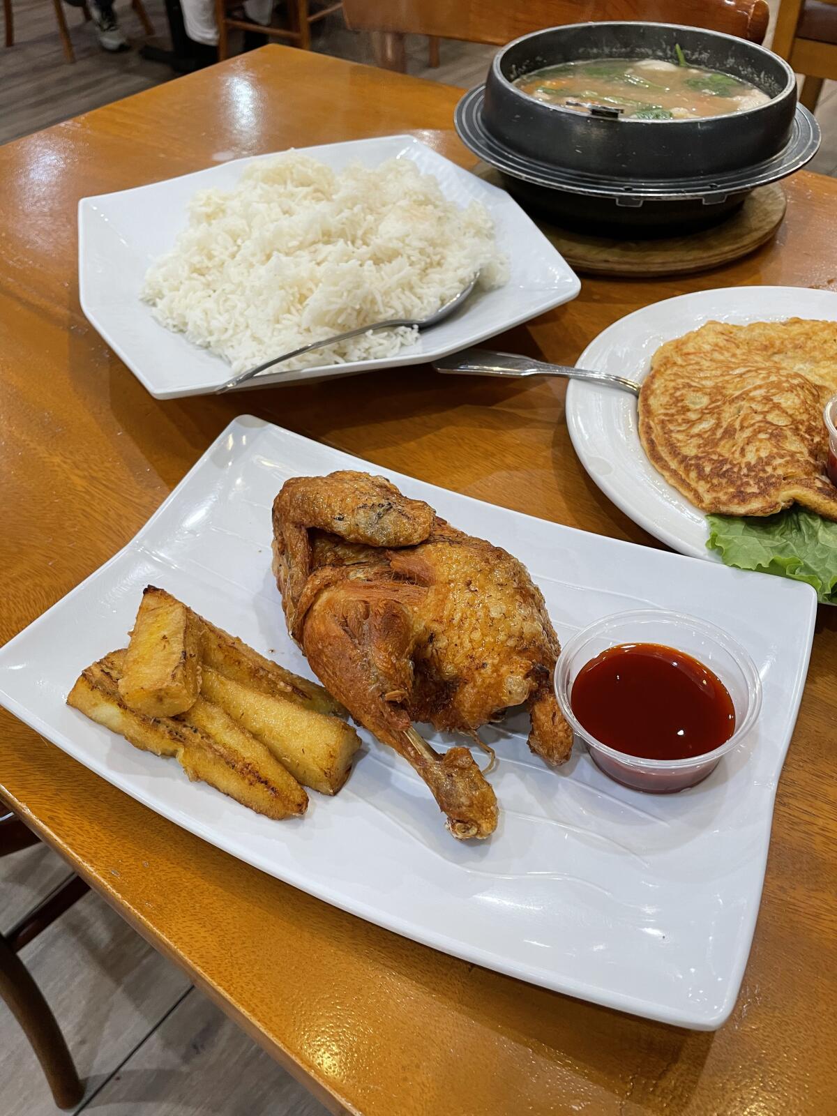 Fried chicken at the center of a meal at Barrio Fiesta, a Filipino restaurant in Anaheim.