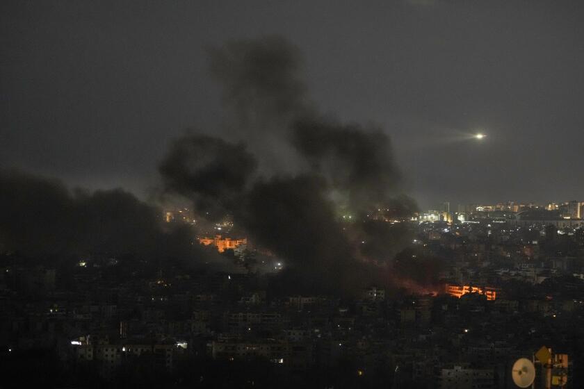 Smoke rises after Israeli airstrikes in Dahiyeh, Beirut, Lebanon, Saturday, Oct. 5, 2024. (AP Photo/Bilal Hussein)