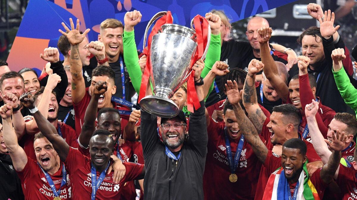 Jurgen Klopp holds aloft the Champions League trophy after Liverpool defeated Tottenham 2-0 in the final on Saturday.
