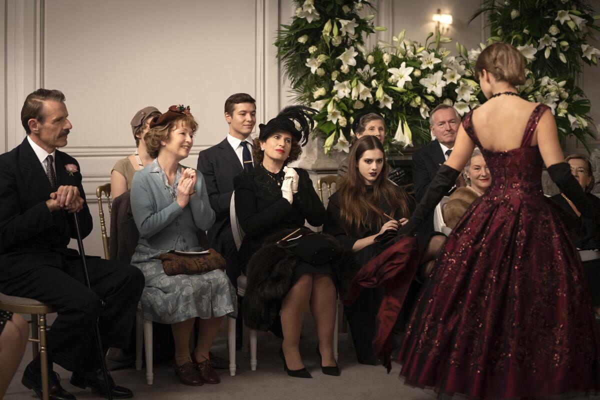 Lambert Wilson, from left, Lesley Manville, Guilaine Londez and Dorottya Ilosvai in a scene from "Mrs. Harris Goes to Paris."