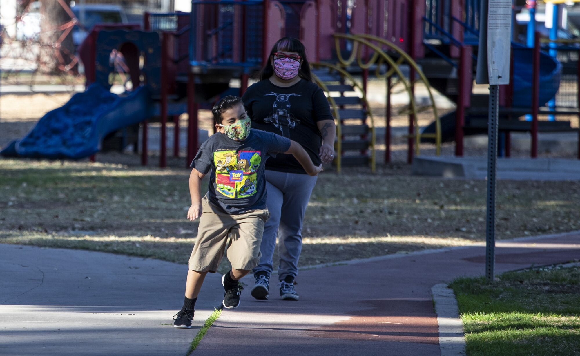 Paloma Yanez and her son, Benny Jr., 7, spend time together in a park.
