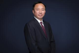 In this image provided by Fox Corp., Viet Dinh, the chief legal officer at the company, poses for a photo. On Friday, Aug. 11, 2023, Fox Corp. said that Dinh, who oversaw a $787 million settlement with Dominion Voting Systems over defamation allegations, is leaving the company. (Courtesy of Fox Corp. via AP)