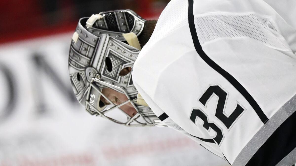 The Kings' Jonathan Quick hangs his head after giving up a goal to the Carolina Hurricanes on Feb. 26 in Raleigh, N.C.