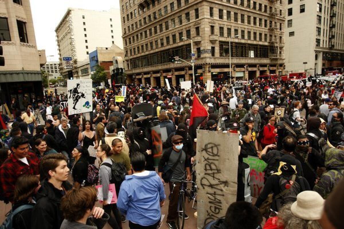 Demonstrators on May Day last year crowd the intersection of 5th and Hill streets in downtown Los Angeles.