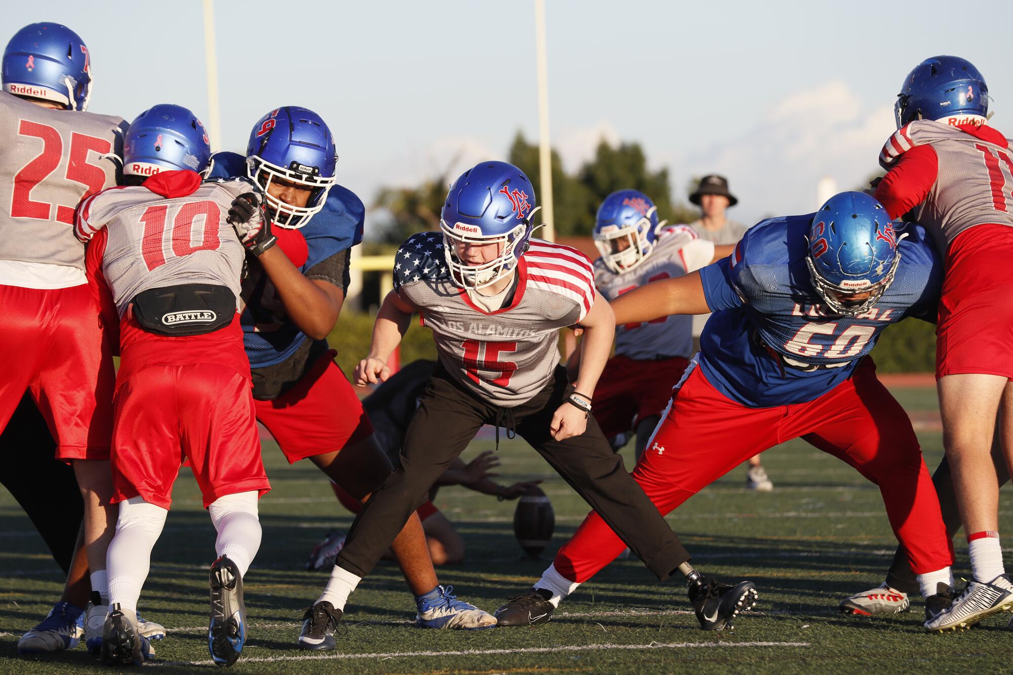 Los Alamitos long snapper Carson Fox takes part in a recent team practice.