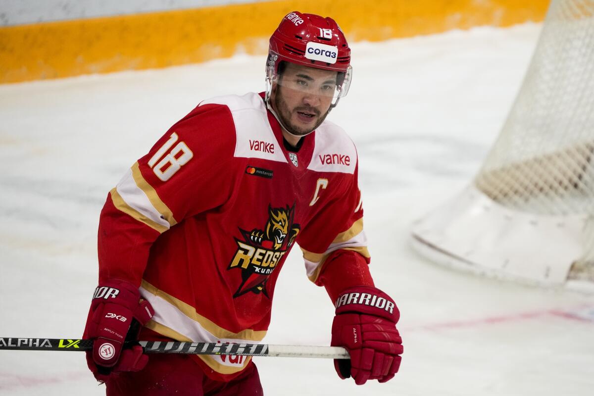 FILE - Kunlun Red Star's Brandon Yip is shown during a Kontinental Hockey League ice hockey match against Russia club Amur Khabarovsk in Mytishchi, just outside Moscow, Russia, Monday, Nov. 15, 2021. Host China has finalized its roster for the men's hockey tournament at the Beijing Olympics. The team includes a dozen players from North America. Some like forward Brandon Yip have Chinese ancestry. (AP Photo/Alexander Zemlianichenko, File)