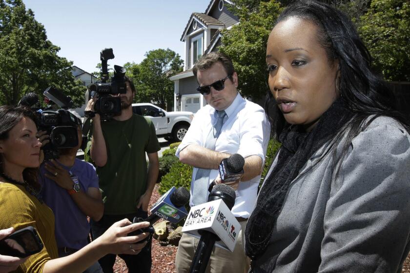 Ina Rogers talks with reporters about the seizure of her 10 children by law enforcement Monday, May 14, 2018, in Fairfield, Calif. Authorities removed the children living at their home on March 31, and placed them in protective custody after one of them ran away. Rogers faces charges of child neglect and her husband Jonathan Allen has been charged with torture and child abuse. Rogers denied the children were mistreatment. (AP Photo/Rich Pedroncelli)