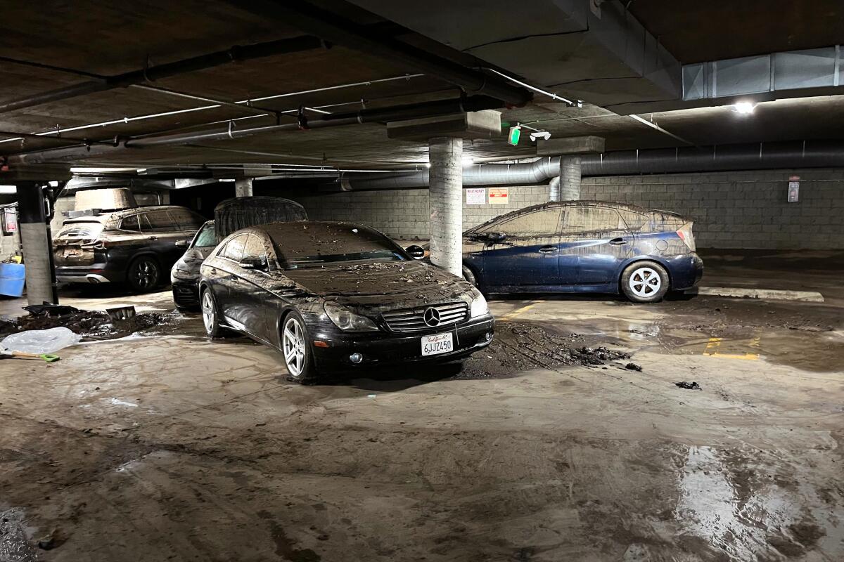 Damaged cars parked on a subterranean level of a Hancock Park condo building’s garage.