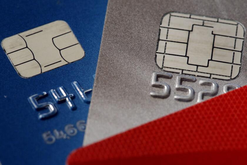 FILE - Credit cards are seen in Philadelphia on June 10, 2015. When a credit card issuer decides to close an account, there may be a narrow window of time in which you can help safeguard your credit scores. (AP Photo/Matt Rourke, File)