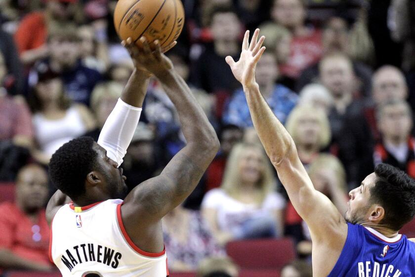 Wesley Matthews shoots over Clippers guard J.J. Redick during a game with the Portland Trail Blazers last season.