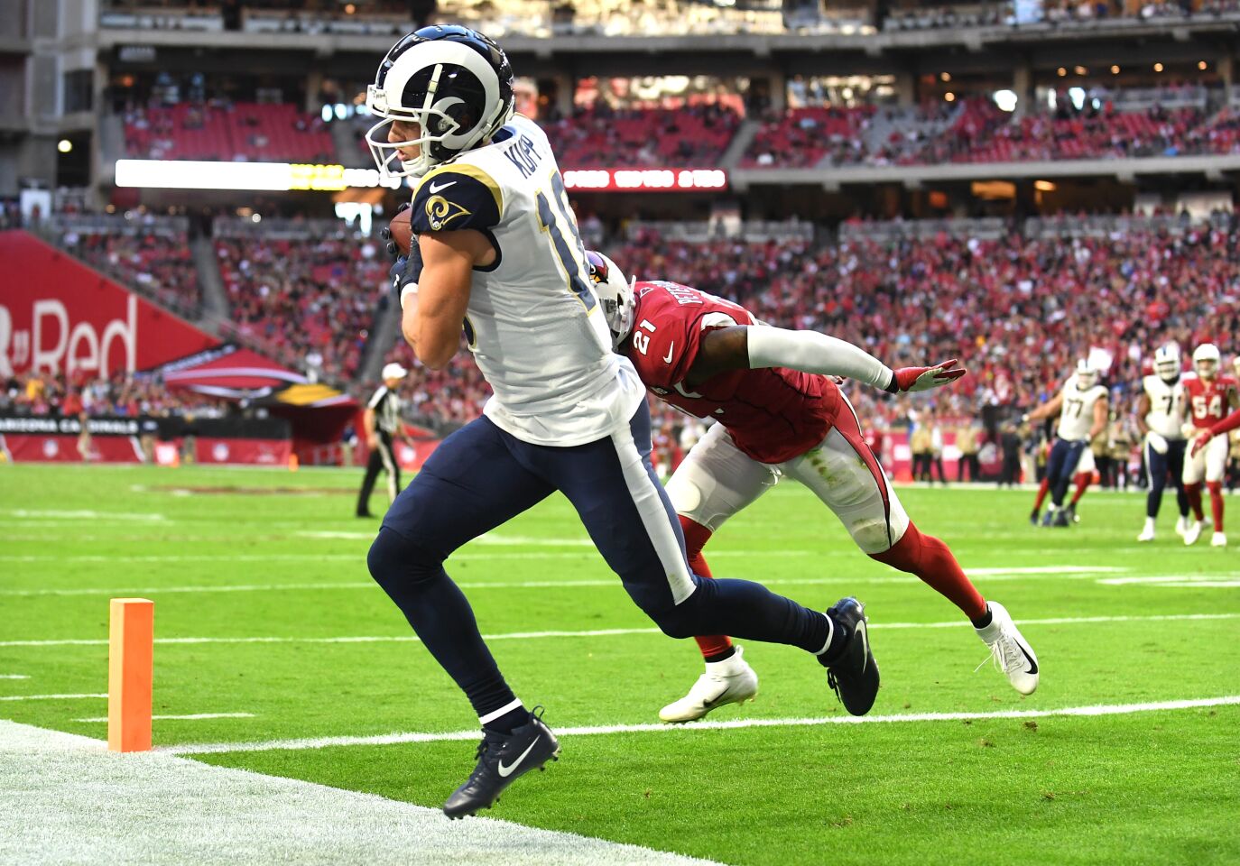 Rams wide receiver Cooper Kupp catches a touchdown pass in front of Cardinals cornerback Patrick Peterson.
