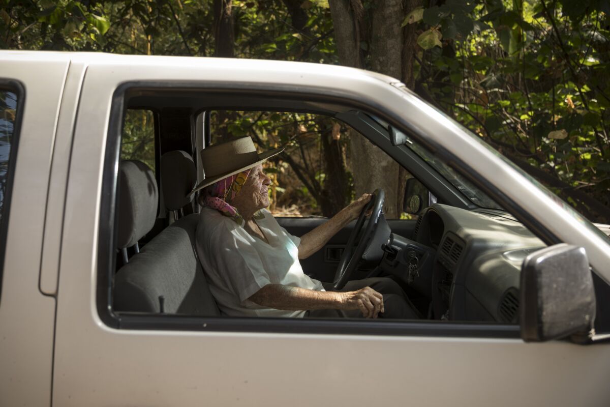 Diana Kennedy at the wheel of her standard-transmission Nissan pickup truck, near her home in Mexico.